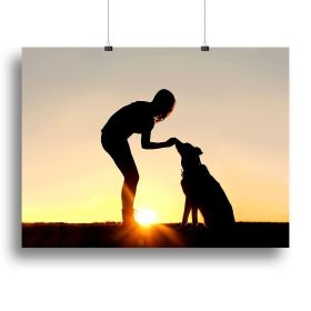 A silhouette of a girl sitting outside in the grass with her pet German Shepherd Mix Dog feeding him treats during training in front of a sunsetting s (Type: Standard Framed Canvas Print, size: 28" x 20" / 70cm x 50cm (approx))